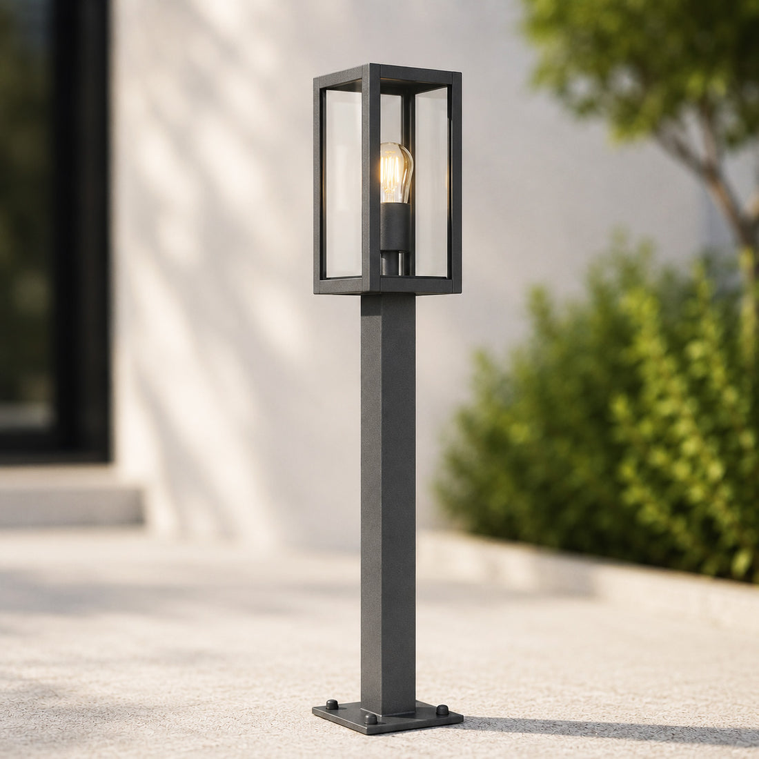 Mirage lantern path light with filament bulb on a sunlit patio