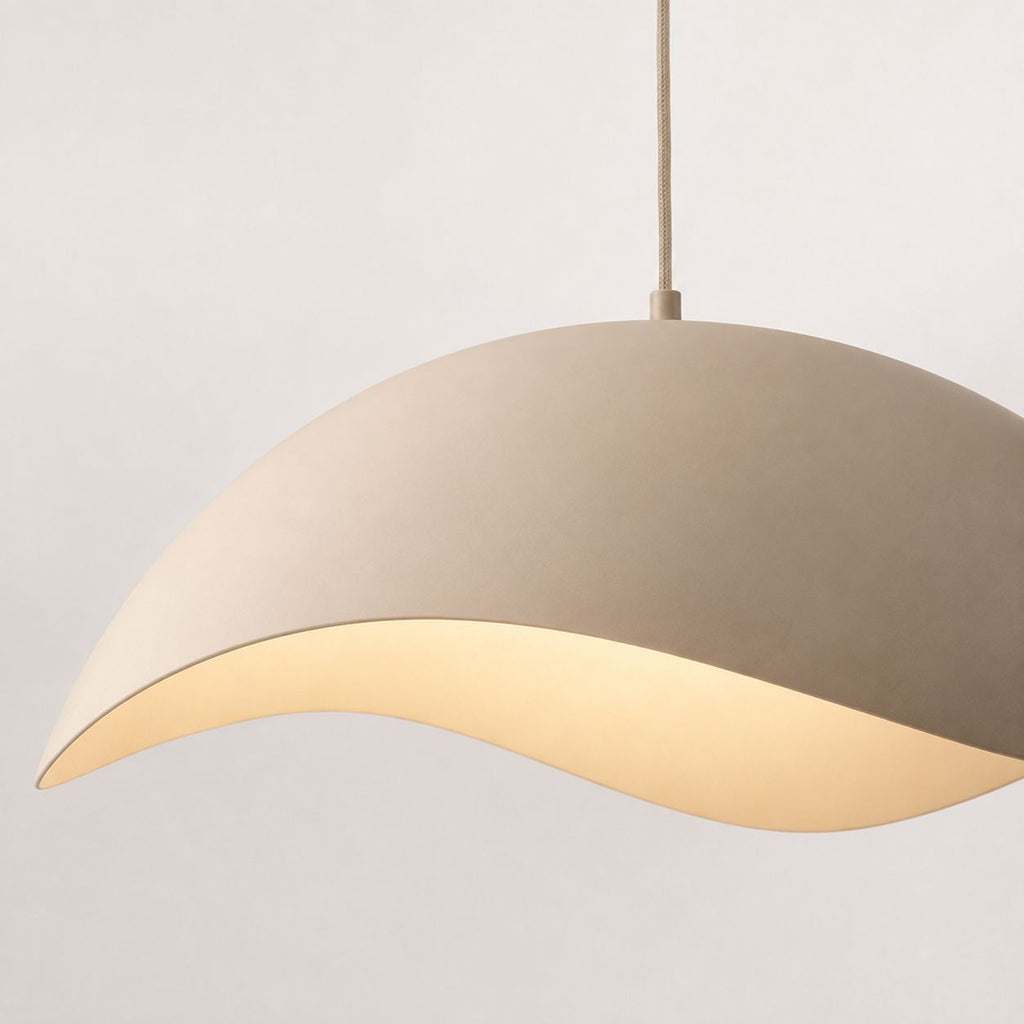 Nami sand taupe wave-shaped metal pendant light, side view on white