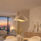 Nami sand taupe wavy pendant lit above a living room table at dusk