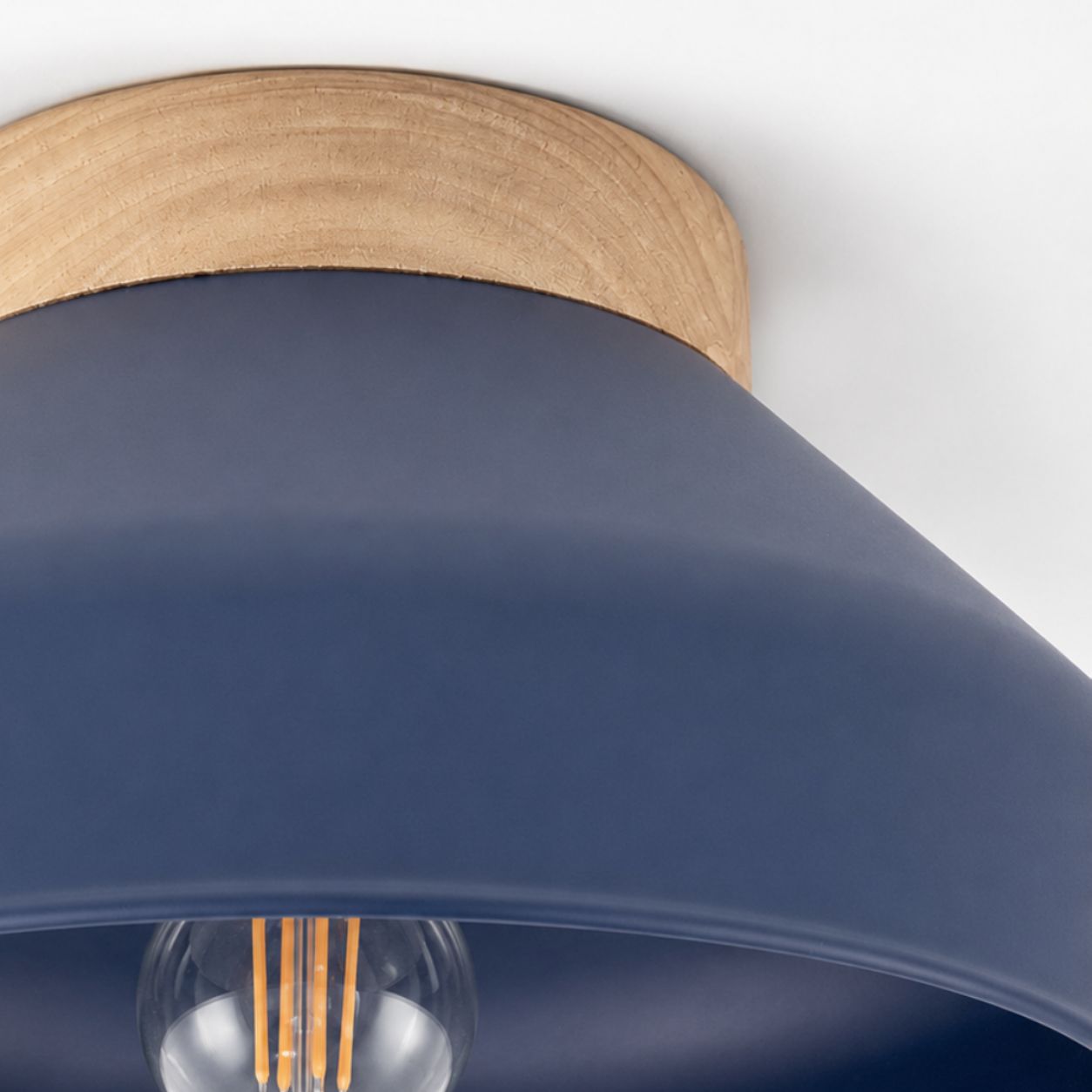 Oslo semi-flush ceiling light, close-up of the blue metal shade and wooden base