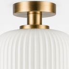 Rivoli ribbed glass ceiling light, close-up of the antique brass ceiling plate