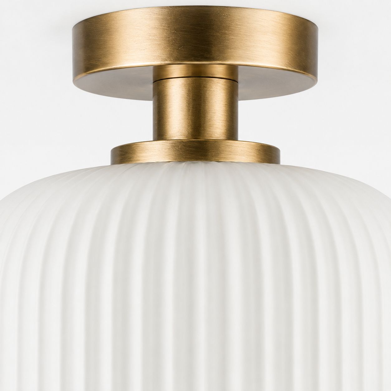 Rivoli ribbed glass ceiling light, close-up of the antique brass ceiling plate