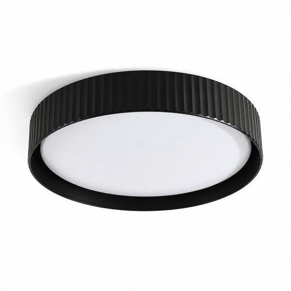 Senna black ribbed LED flush ceiling light, angled view on white