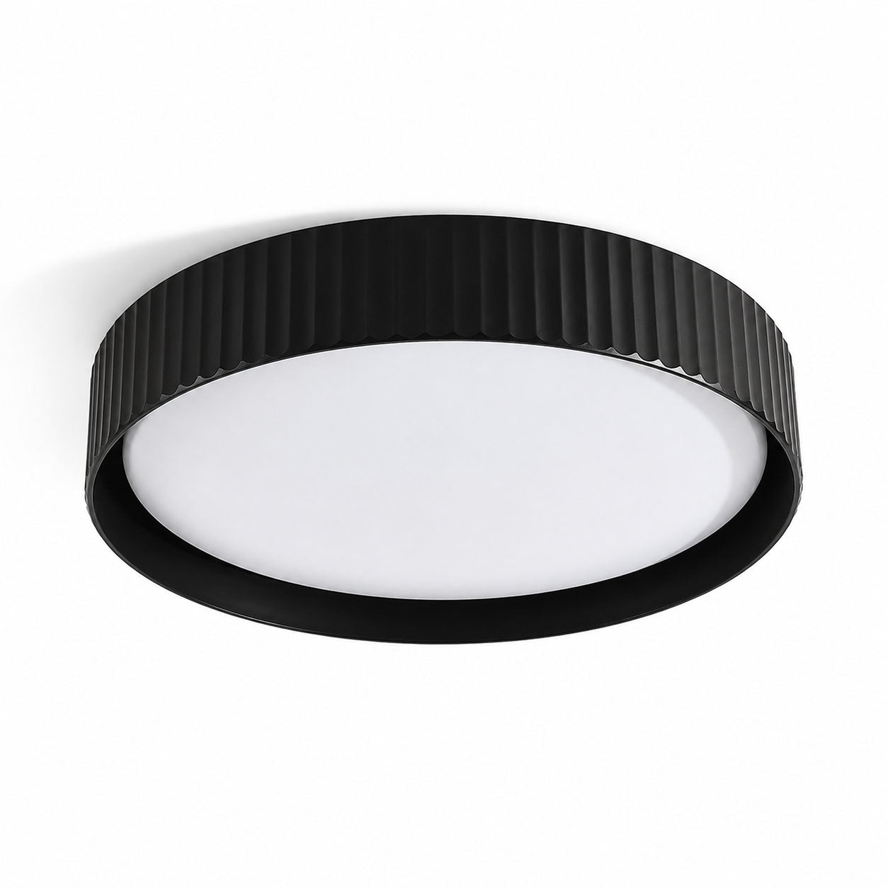 Senna black ribbed LED flush ceiling light, angled view on white