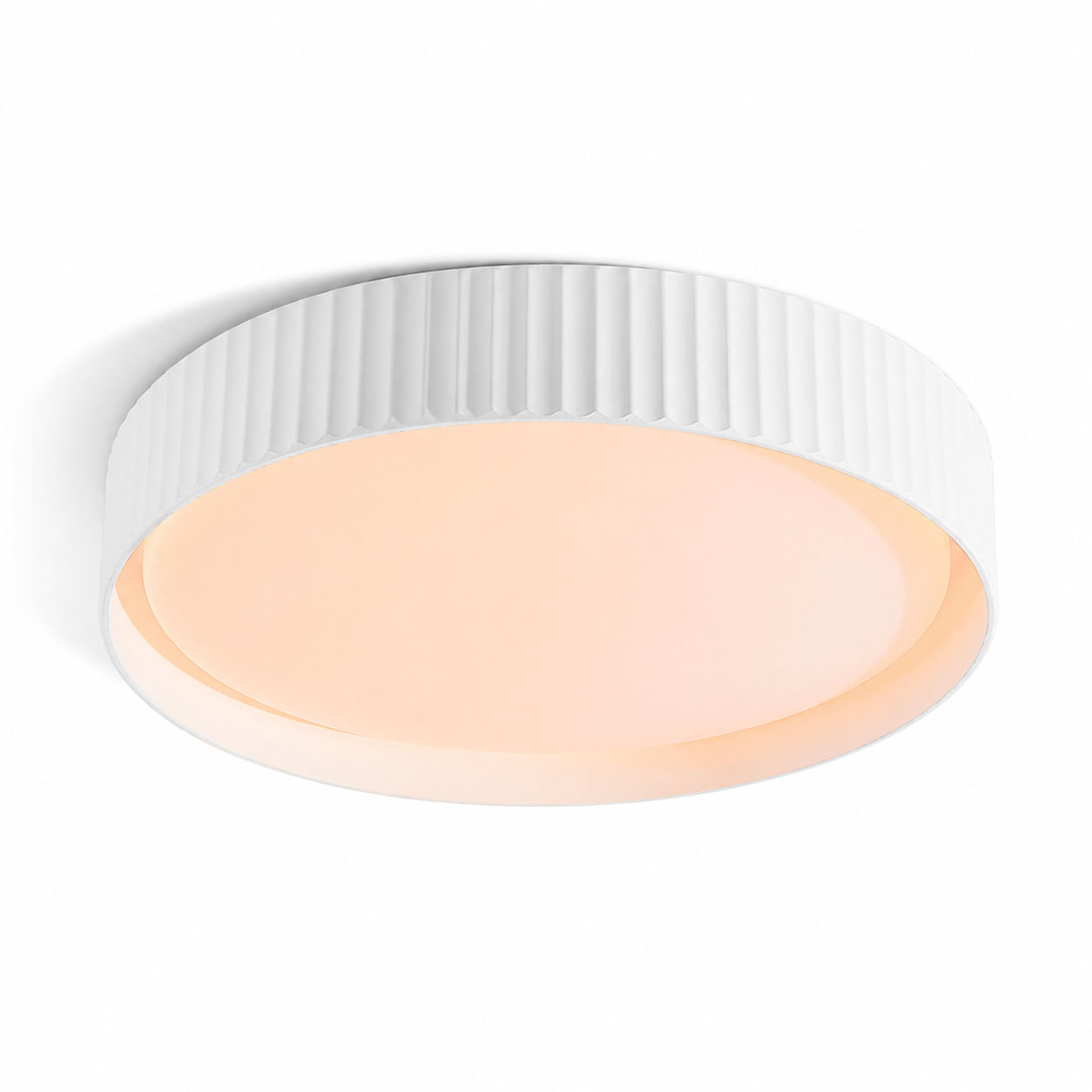 Senna white ribbed LED flush ceiling light, angled view on white