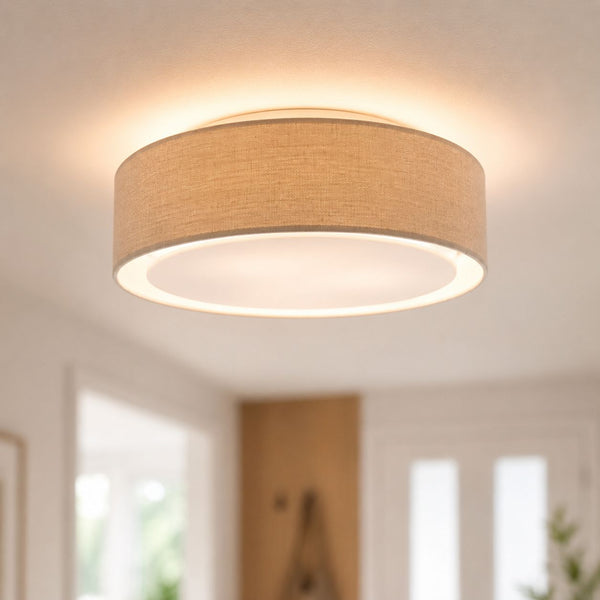 Senna dove grey linen drum flush ceiling light lit in a hallway