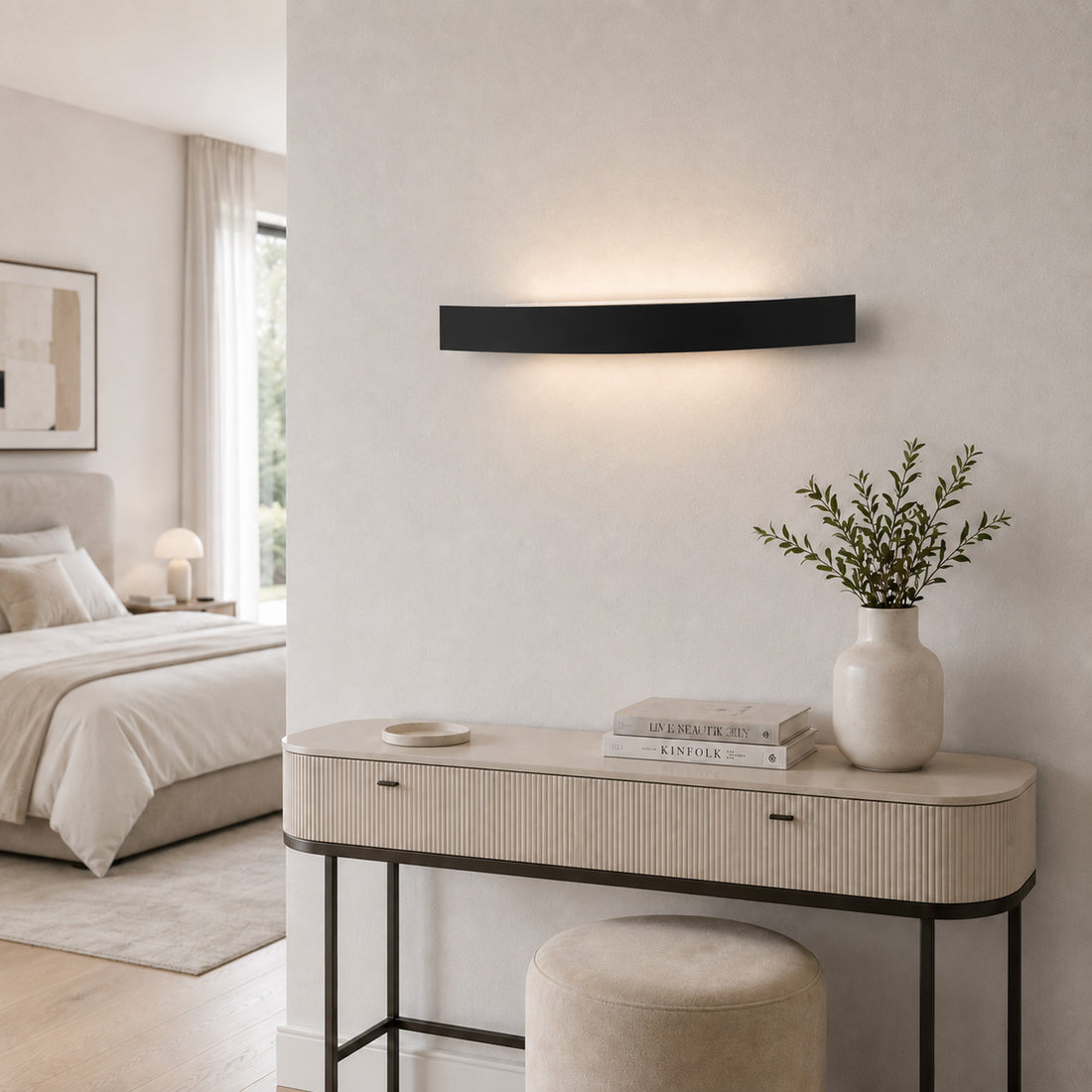 Spoiler black LED wall light glowing above a ribbed dressing table
