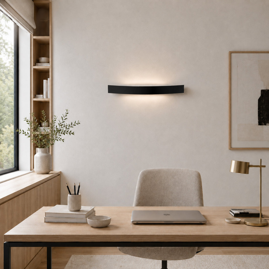 Spoiler matt black wall light lit over a home office desk
