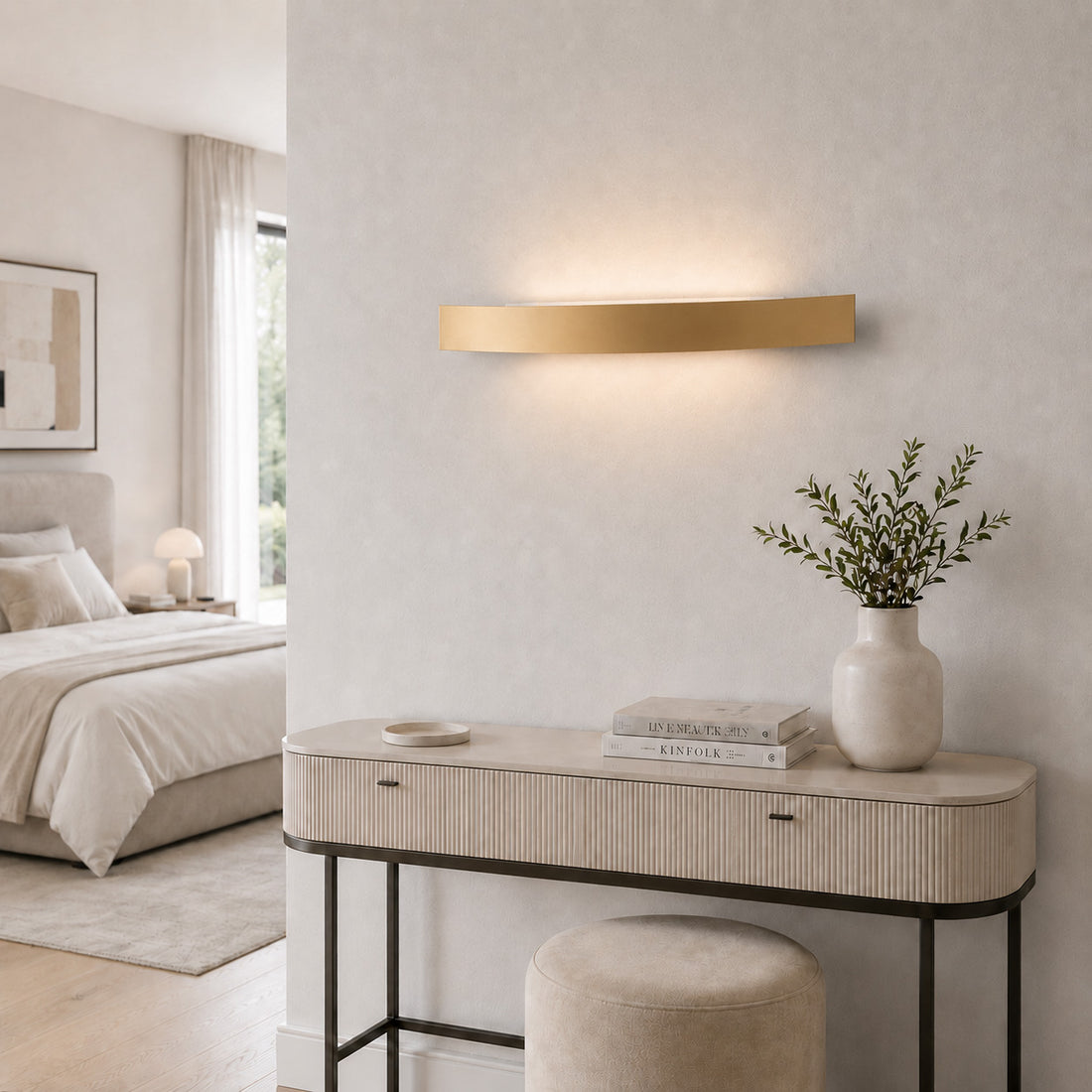 Spoiler gold LED wall light glowing above a ribbed dressing table