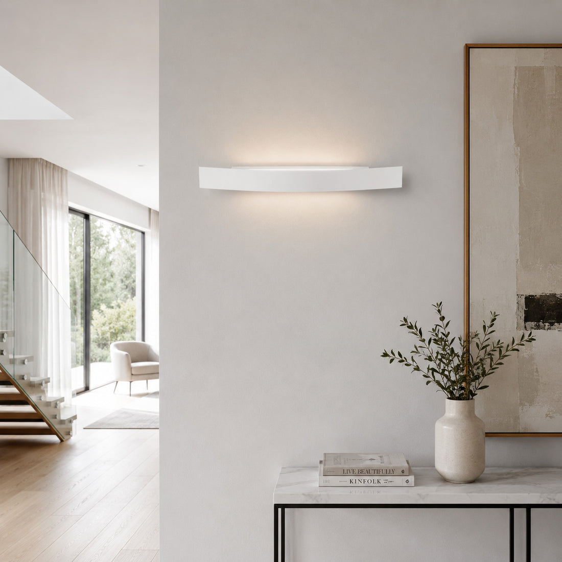 Spoiler white LED washer light lit above a slim console by the stairs