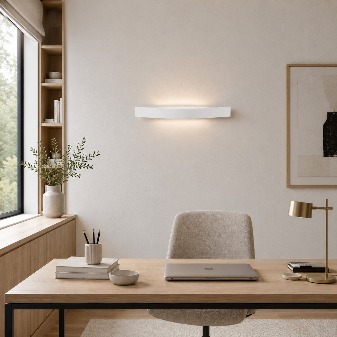 Spoiler white LED wall light lit above a desk in a bright study