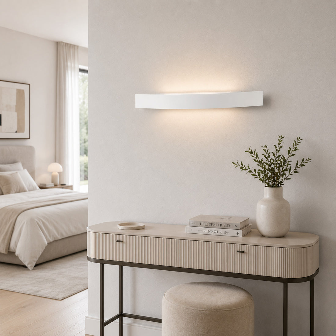 Spoiler white wall light glowing over a dressing table in a soft bedroom