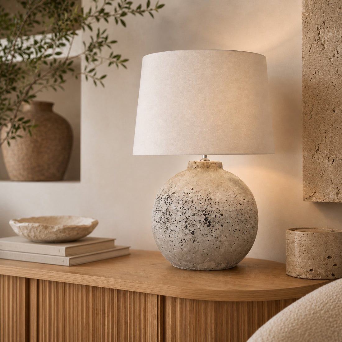 Tiber flecked stone lamp styled with ceramics on an oak fluted console