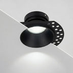 Kanto Mini matt black trimless downlight with plaster-in flange, cool white beam