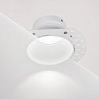 Tilt adjustment on the matt white Kanto trimless plaster-in downlight