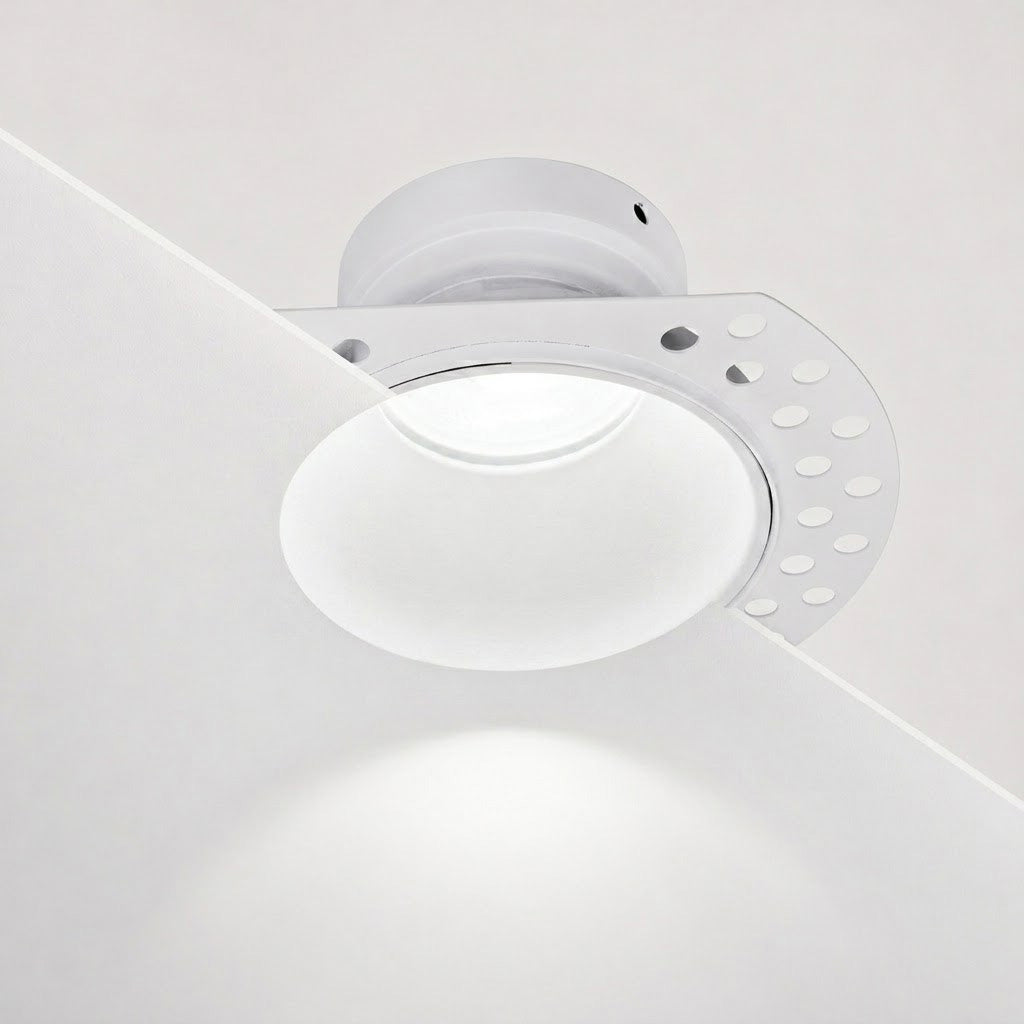 Tilt adjustment on the matt white Kanto trimless plaster-in downlight