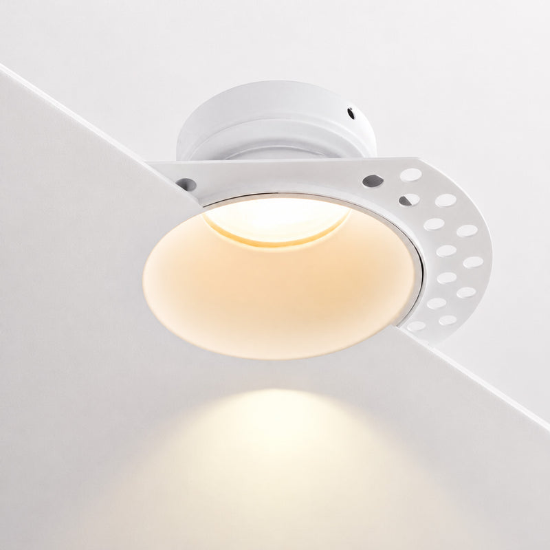 Kanto fixed trimless plaster-in downlight in matt white glowing warm white