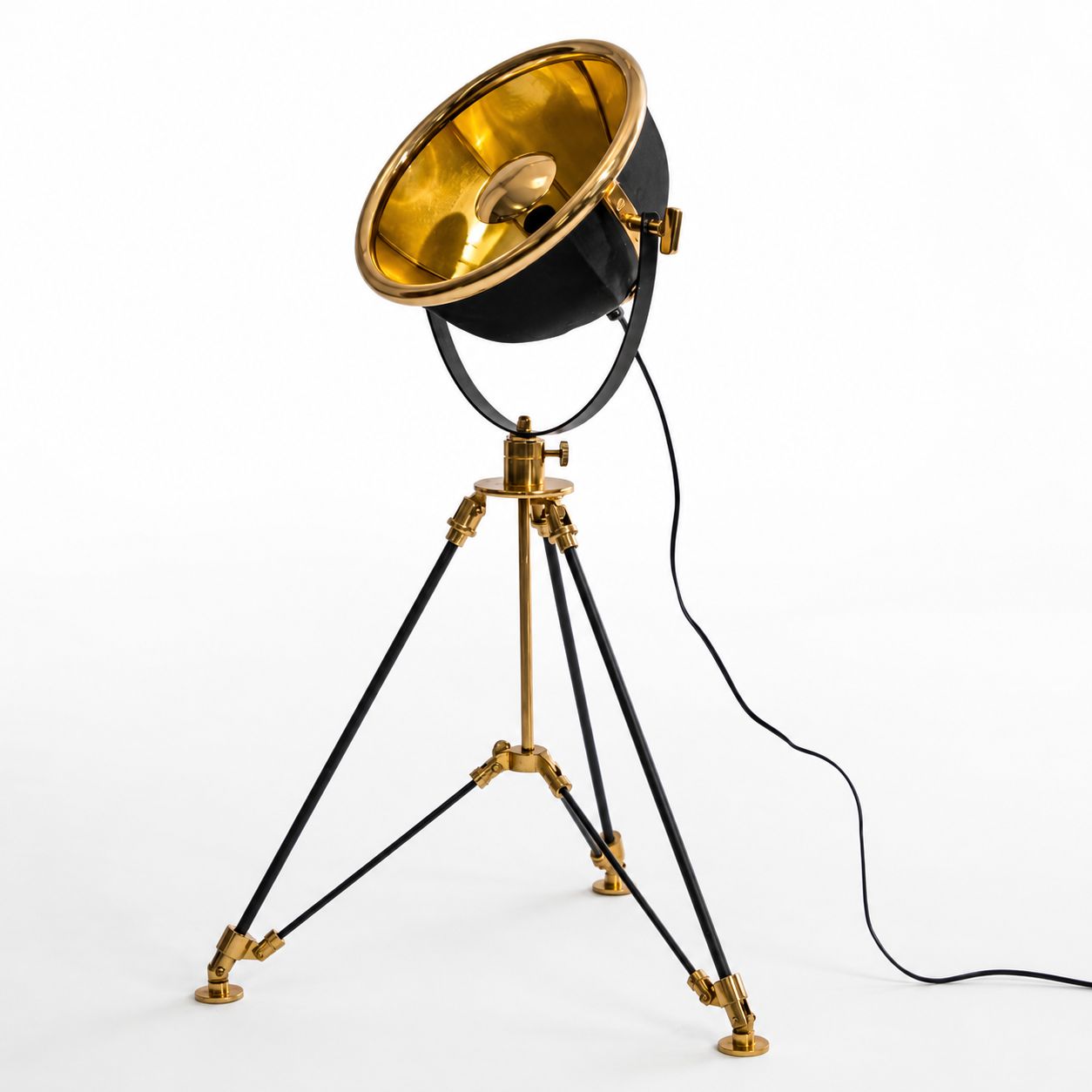 Valen black and brass tripod table lamp with gold reflector, on white