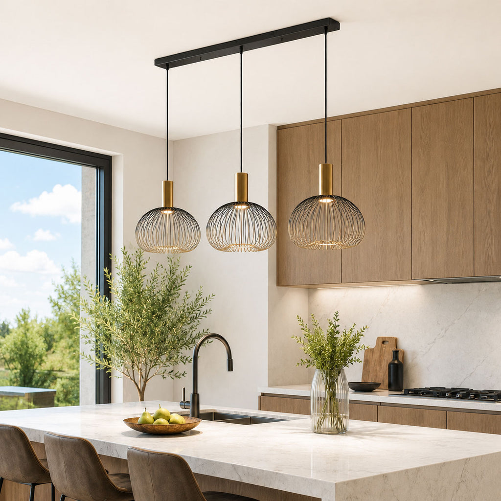 Velia black and gold triple cage pendant over a kitchen island in daylight