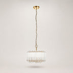 Veyra gold and glass drum pendant on a long chain, full view on white