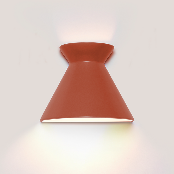 Kiro small burnt orange ceramic wall light casting light up and down