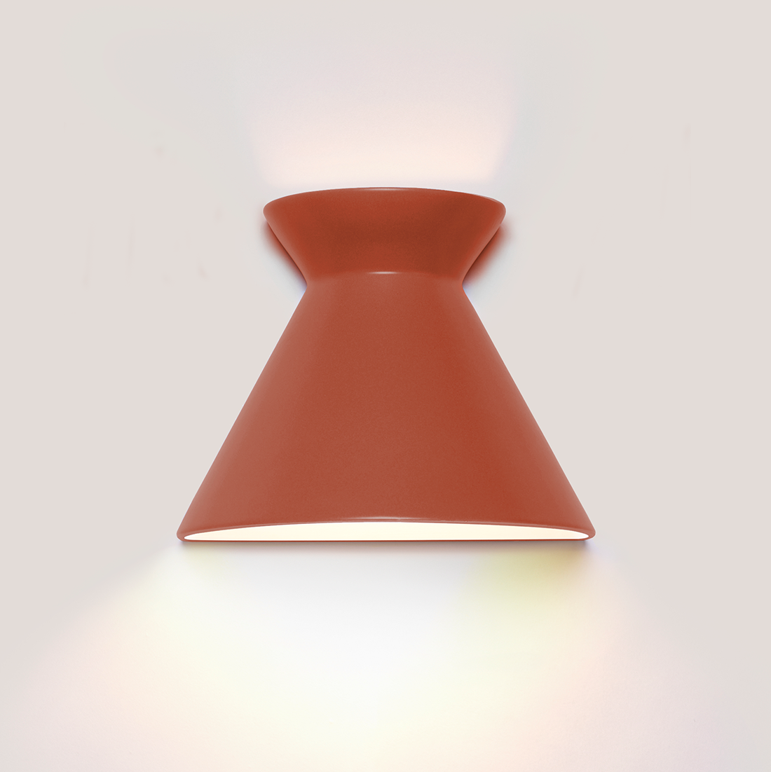 Kiro small burnt orange ceramic wall light casting light up and down