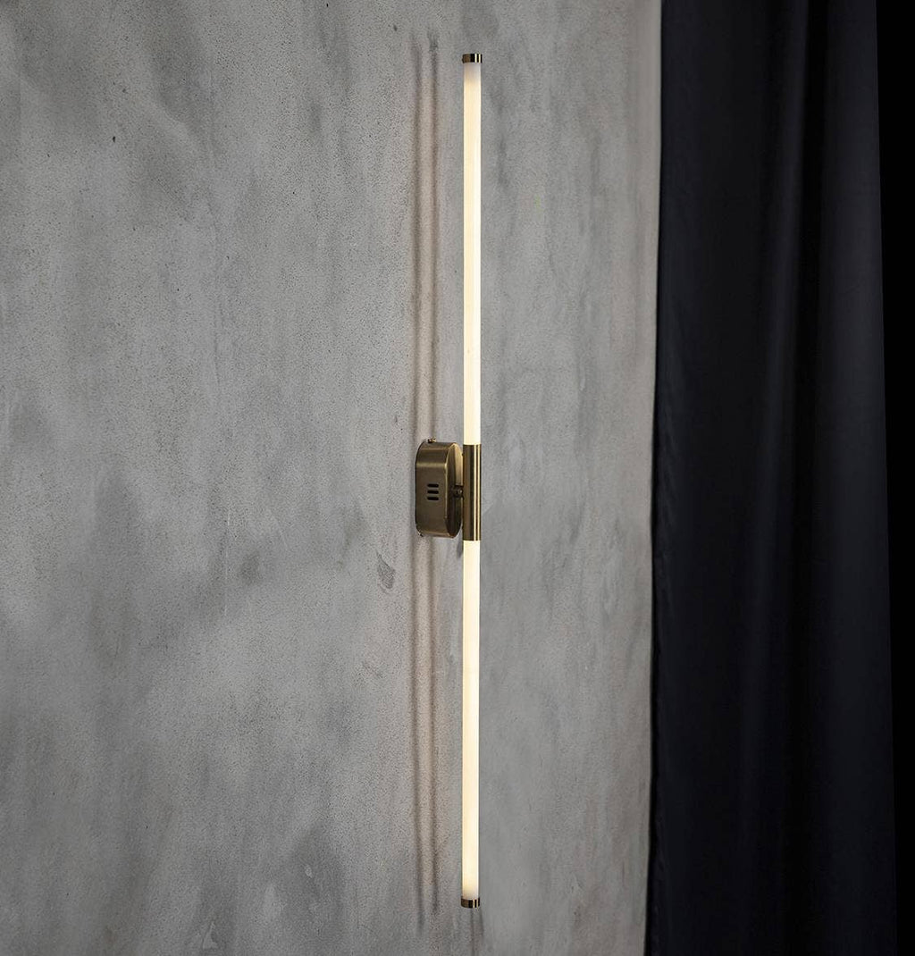 Close-up of Akra wall light antiqued metal finish and plexiglass diffuser detail