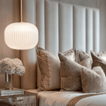 Bellamy white and gold ribbed glass circular pendant ceiling light hanging in modern interior