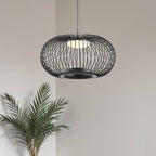 Solna black metal cage pendant light with dimmable bulb hanging in modern interior