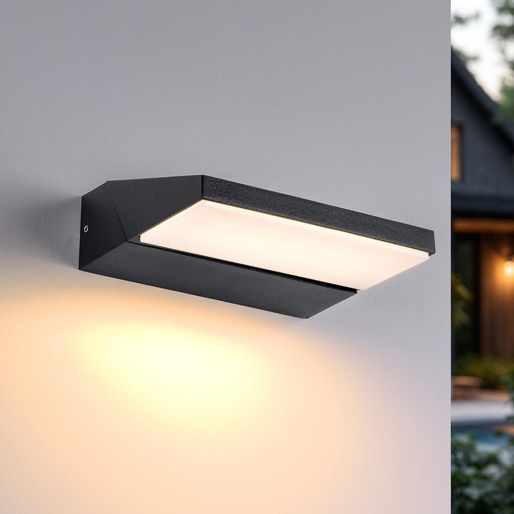 Renzo adjustable outdoor LED wall light in black mounted on exterior wall