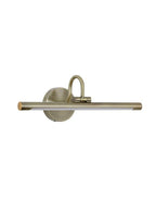 Cordless brass picture light mounted above framed artwork in modern interior