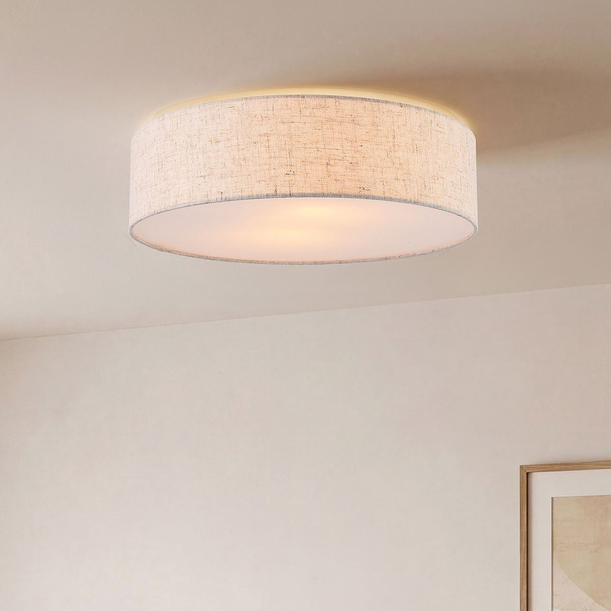 Solva beige linen drum shade ceiling light fitted in modern living room
