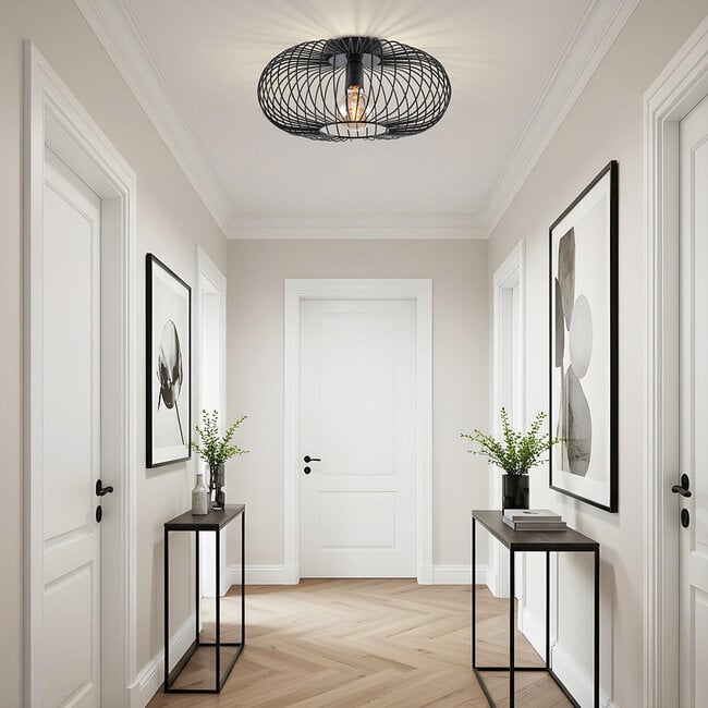 Industrial black cage ceiling light fitted in modern kitchen interior