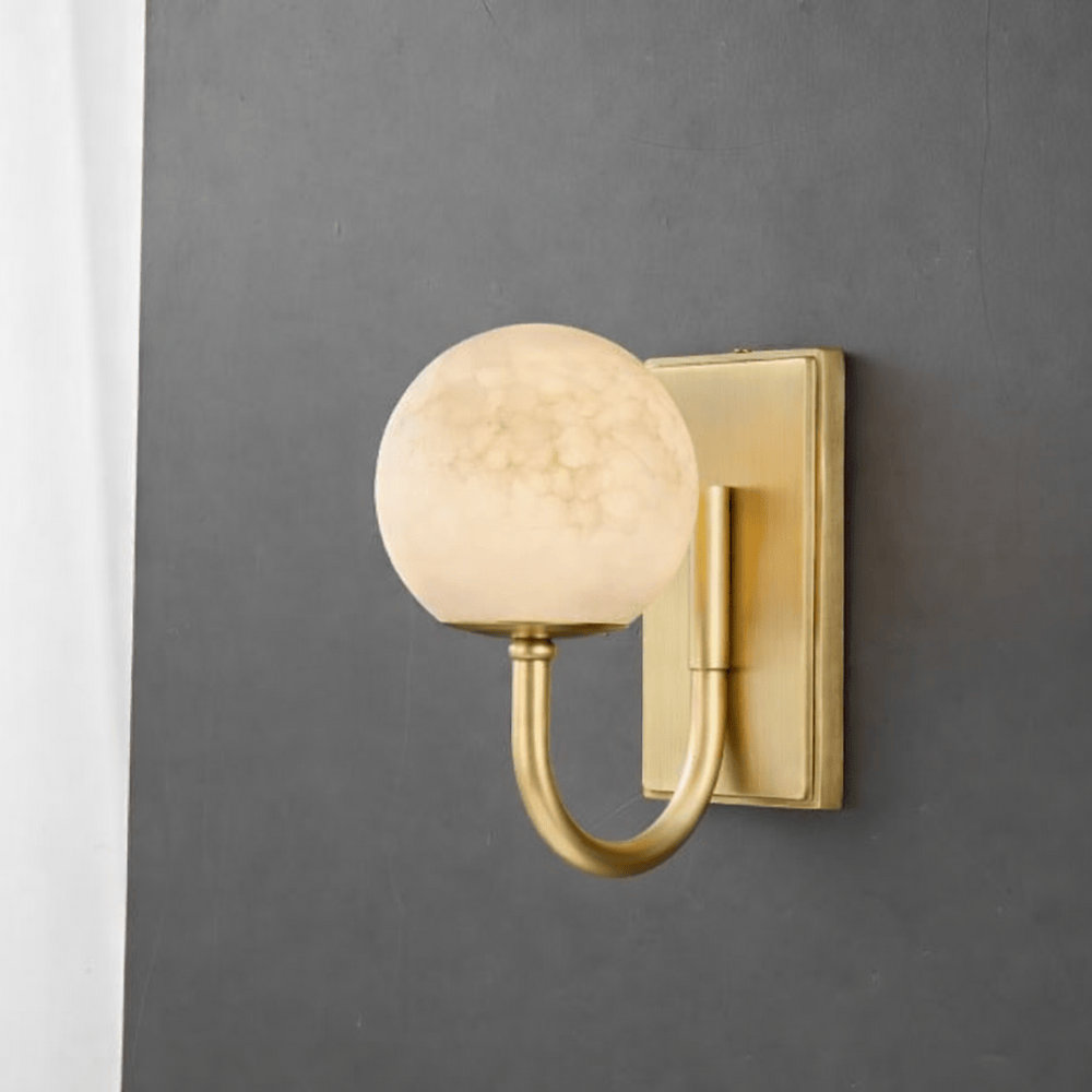 Alabaster Globe Wall Light — Satin Brass in a room