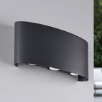 Kyra outdoor wall light illuminated at night showing upward and downward light effect