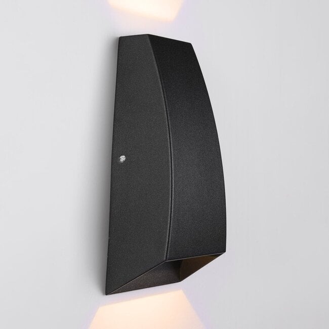 Silas outdoor wall light illuminated at night on home exterior