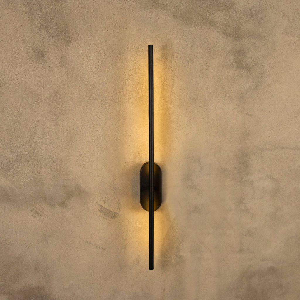 Assos 70cm matt black LED wall light mounted on white wall