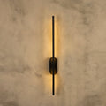 Assos 70cm matt black LED wall light mounted on white wall
