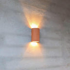 Close-up of artisan fluted ceramic detailing on Terra wall sconce