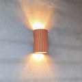 Terra fluted terracotta ceramic wall sconce showing hand-carved ridged texture
