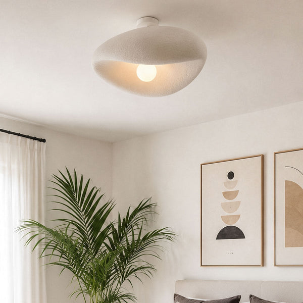 Kaia white stone-effect curved ceiling light 60cm diameter shown illuminated
