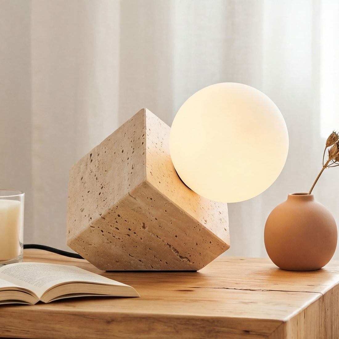 Isla travertine globe table lamp in sand beige with tilted opal glass shade