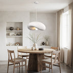 Close-up of Kaia sculptural white stone pendant light showing curved organic shape