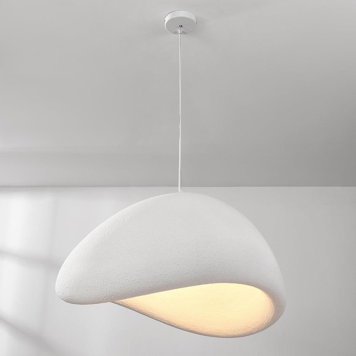 Large 80cm Senja white pendant light in double-height hallway interior setting