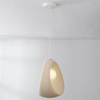 Akari wabi-sabi style pendant light illuminated in dining nook setting