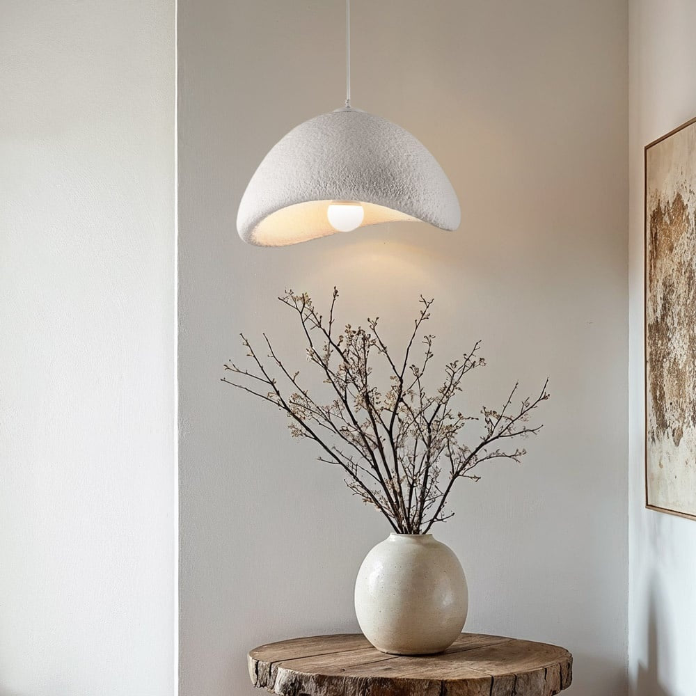 Senja white cloud pendant light with stone-effect texture hanging above dining table