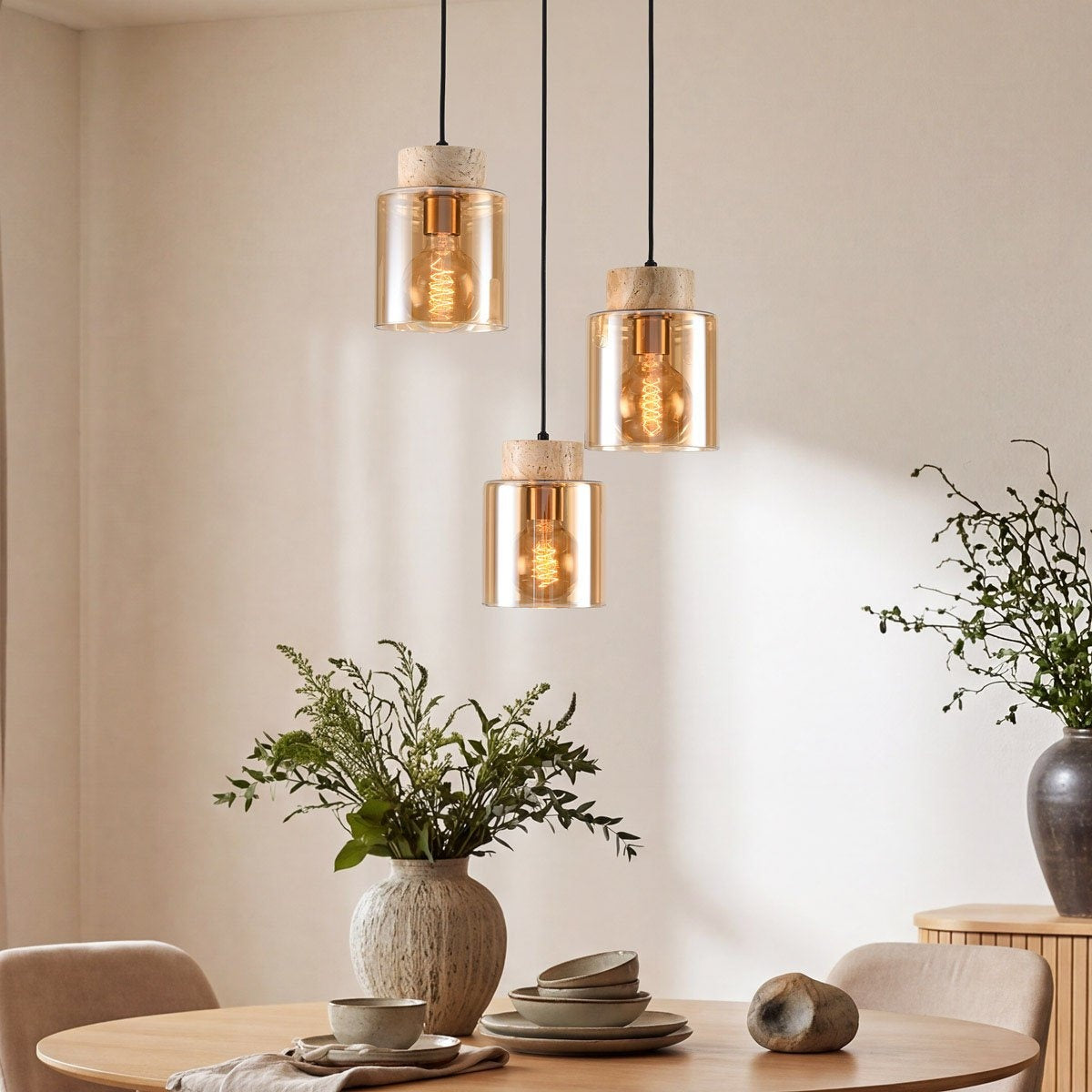 Akiko three light pendant with amber glass shades and travertine stone detail