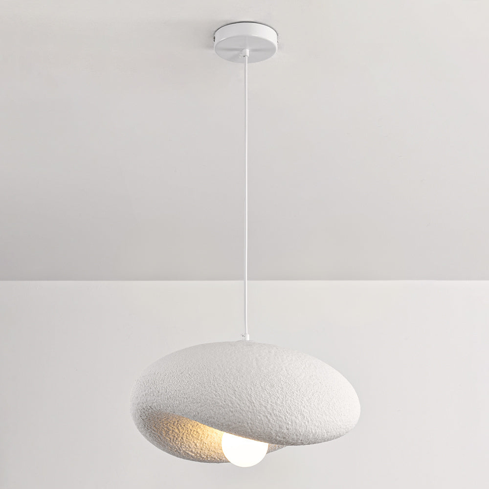 Kaia white pendant light illuminated casting ambient glow in modern interior