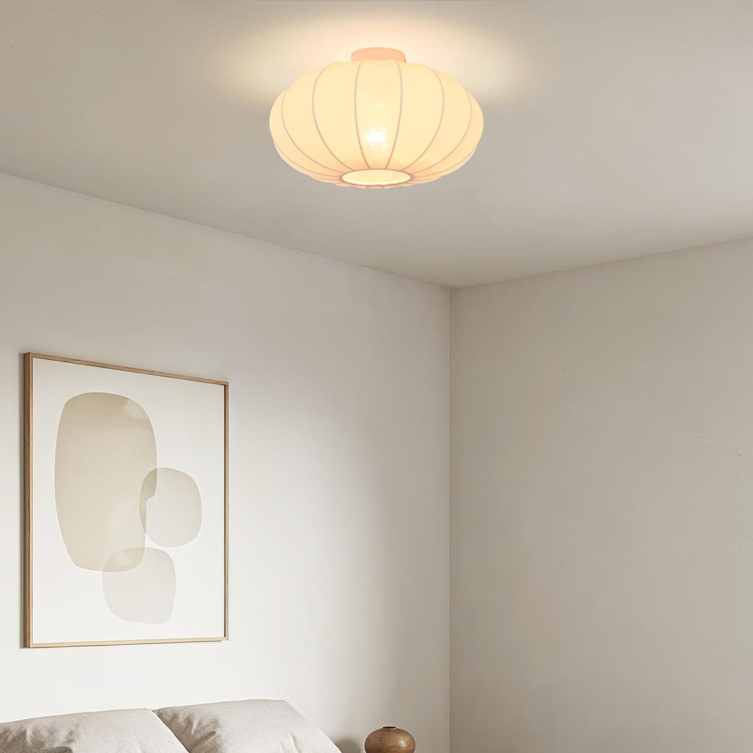 Aya fabric ceiling light illuminated showing warm diffused glow in living room