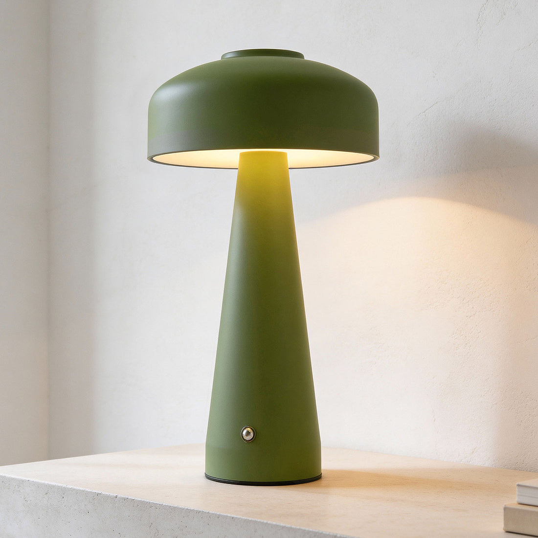 Momo rechargeable mushroom table lamp in green finish on bedside table